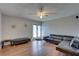 Cozy living room featuring laminate floors and a ceiling fan at 4722 Millpond Ln, Tampa, FL 33624