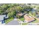 An aerial shot of a house shows mature landscaping and a well-maintained lawn at 50 Pembrook Cir, Palm Harbor, FL 34683