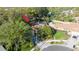Aerial view of the property showcasing the roof, yard, and surrounding neighborhood at 50 Pembrook Cir, Palm Harbor, FL 34683