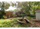 Backyard featuring a picnic table and mature trees at 50 Pembrook Cir, Palm Harbor, FL 34683