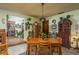Cozy dining room featuring wood furniture, charming decor, and warm lighting, perfect for intimate gatherings at 50 Pembrook Cir, Palm Harbor, FL 34683