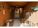 Cozy entryway adorned with plants and decorative items, welcomes visitors with a warm and inviting ambiance at 50 Pembrook Cir, Palm Harbor, FL 34683