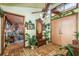 Lovely foyer featuring wood-look tile, a ceiling fan, and decorative accents creating a warm welcome to the home at 50 Pembrook Cir, Palm Harbor, FL 34683