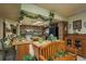 Traditional kitchen with wooden cabinetry, center islands, and decorative plants creating a warm, inviting space at 50 Pembrook Cir, Palm Harbor, FL 34683