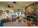 Inviting living room with a stone fireplace, comfortable seating, and plenty of natural light at 50 Pembrook Cir, Palm Harbor, FL 34683