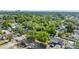 Wide aerial shot showcasing a neighborhood, the water, and the city skyline off in the distance at 5302 S Himes Ave, Tampa, FL 33611