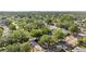 Wide aerial shot of a lush, green neighborhood undergoing infrastructure repairs at 5302 S Himes Ave, Tampa, FL 33611