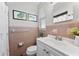 The bathroom has tiled walls, white vanity, and decor at 5302 S Himes Ave, Tampa, FL 33611