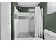 The updated bathroom features a tiled walk-in shower and modern fixtures at 5302 S Himes Ave, Tampa, FL 33611