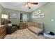 Charming Bedroom with a wood crib, comfortable chair, and soothing green walls at 5302 S Himes Ave, Tampa, FL 33611