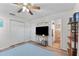 The bedroom has a closet and shelves for storage, with an attached bathroom at 5302 S Himes Ave, Tampa, FL 33611