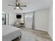 The spacious bedroom has a large window and wood-look vinyl flooring at 5302 S Himes Ave, Tampa, FL 33611