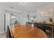 Open to living areas, the dining area features a wood table and mini wine cooler at 5302 S Himes Ave, Tampa, FL 33611