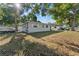 Well-kept single-story home with a boat parked nearby, showcasing outdoor space at 5302 S Himes Ave, Tampa, FL 33611