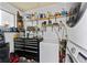 Organized garage area with tool storage, shelving, and modern laundry appliances at 5302 S Himes Ave, Tampa, FL 33611