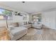 Cozy living room featuring a comfortable sectional, natural light, and stylish decor at 5302 S Himes Ave, Tampa, FL 33611