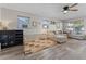 Spacious living room with a large sectional couch and ample natural light at 5302 S Himes Ave, Tampa, FL 33611