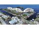 An aerial view of the waterfront condo community with boat docks and tennis courts at 5915 Sea Ranch Dr # 512, Hudson, FL 34667