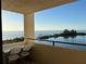 Scenic waterfront view from the balcony with seating for two at 5915 Sea Ranch Dr # 512, Hudson, FL 34667