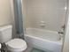 Bright and clean bathroom featuring a tiled shower-tub combination and modern fixtures at 5915 Sea Ranch Dr # 512, Hudson, FL 34667