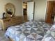 Bedroom featuring a decorative dresser, ample space and access to bathroom and kitchen, offering convenience and style at 5915 Sea Ranch Dr # 512, Hudson, FL 34667