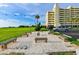 Charming communal area offers benches, string lights, and a grassy area at 5915 Sea Ranch Dr # 512, Hudson, FL 34667