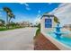 Welcoming entrance to Gulf Island Beach & Tennis Club with lush landscaping and water fountain at 5915 Sea Ranch Dr # 512, Hudson, FL 34667