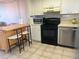 Efficient kitchen features a breakfast bar, modern appliances, and ample counter space for convenient meal preparation at 5915 Sea Ranch Dr # 512, Hudson, FL 34667