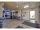 A well-lit condo lobby features tile floors, mailboxes, and entry to garage at 5915 Sea Ranch Dr # 512, Hudson, FL 34667