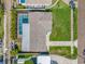 Aerial view of the property, highlighting the pool, roof, and backyard at 6345 Dartmouth N Ave, St Petersburg, FL 33710