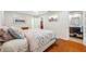 This main bedroom features hardwood floors and access to an ensuite bathroom and walk-in closet at 6345 Dartmouth N Ave, St Petersburg, FL 33710
