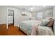 The main bedroom includes hardwood floors and a walk-in closet at 6345 Dartmouth N Ave, St Petersburg, FL 33710