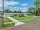 Charming single-story home with manicured lawn and brick driveway at 6345 Dartmouth N Ave, St Petersburg, FL 33710