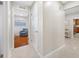 Hallway showing access to the bedroom with a blue armchair and the kitchen at 6345 Dartmouth N Ave, St Petersburg, FL 33710