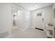 Clean hallway featuring neutral tones, terrazzo flooring, and multiple entryways for easy navigation at 6345 Dartmouth N Ave, St Petersburg, FL 33710