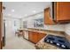 Bright kitchen with stainless steel appliances, granite countertops, and wood cabinets at 6345 Dartmouth N Ave, St Petersburg, FL 33710