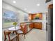 Well-lit kitchen featuring granite countertops, stainless steel appliances, and wood cabinets at 6345 Dartmouth N Ave, St Petersburg, FL 33710