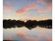 Lake view with colorful sunset clouds reflecting on the water at 6345 Dartmouth N Ave, St Petersburg, FL 33710