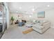 Bright and airy living room with comfortable seating, stylish decor, and access to the outdoors at 6345 Dartmouth N Ave, St Petersburg, FL 33710