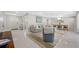Spacious living area with beach artwork, modern furniture, and an inviting atmosphere for relaxation at 6345 Dartmouth N Ave, St Petersburg, FL 33710