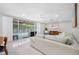 Bright open-concept living space seamlessly integrating indoor comfort with outdoor views and access to pool at 6345 Dartmouth N Ave, St Petersburg, FL 33710