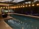 Outdoor pool area with a screened enclosure, string lights, and comfortable seating at 6345 Dartmouth N Ave, St Petersburg, FL 33710