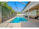 Lovely screened-in pool with attached patio space, perfect for backyard relaxation at 6345 Dartmouth N Ave, St Petersburg, FL 33710