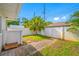 Landscaped side yard featuring a brick walkway and privacy fence at 6345 Dartmouth N Ave, St Petersburg, FL 33710