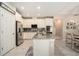 Bright kitchen featuring stainless steel appliances, granite countertops and modern finishes at 6477 Dutton Dr, Wesley Chapel, FL 33545