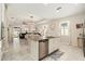 Modern kitchen island with granite countertops and stainless steel dishwasher, perfect for cooking at 6477 Dutton Dr, Wesley Chapel, FL 33545