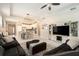 Open living room with tile flooring, recessed lighting, and an adjacent kitchen area at 6477 Dutton Dr, Wesley Chapel, FL 33545