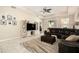Spacious living room with a modern entertainment center and comfortable seating area at 6477 Dutton Dr, Wesley Chapel, FL 33545