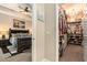 Bright main bedroom adjacent to a well-organized walk-in closet with shelving and chandelier at 6477 Dutton Dr, Wesley Chapel, FL 33545