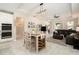 Open-concept kitchen, dining, and living area with plenty of natural light at 6477 Dutton Dr, Wesley Chapel, FL 33545